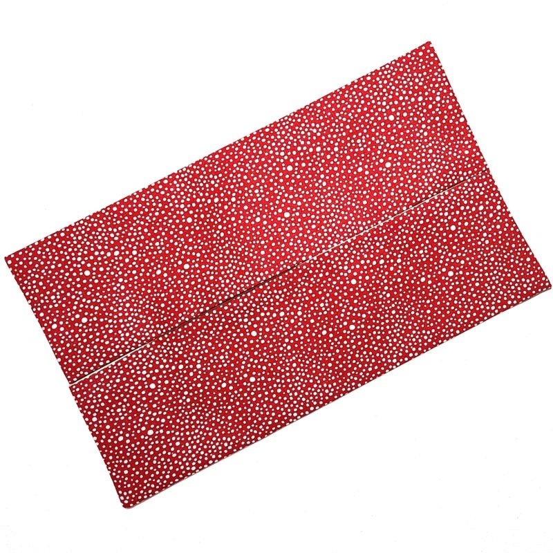 Sewn flat pouch in white dots on red background pattern to hold facial tissues