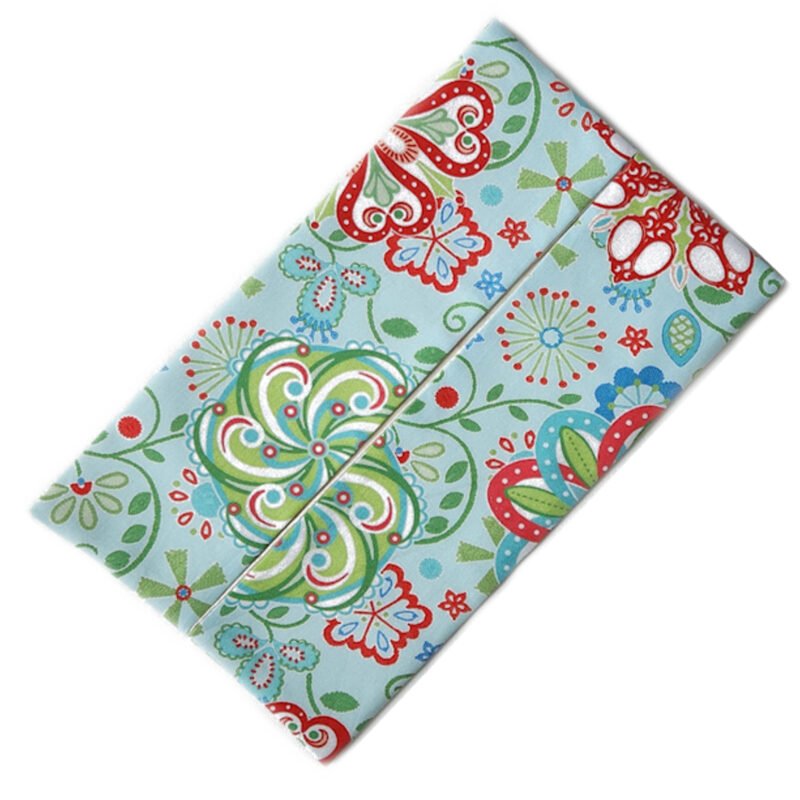 flat rectangular pouch for facial tissues made from fabric in bohemian pattern with teal, red, white and light blue accents
