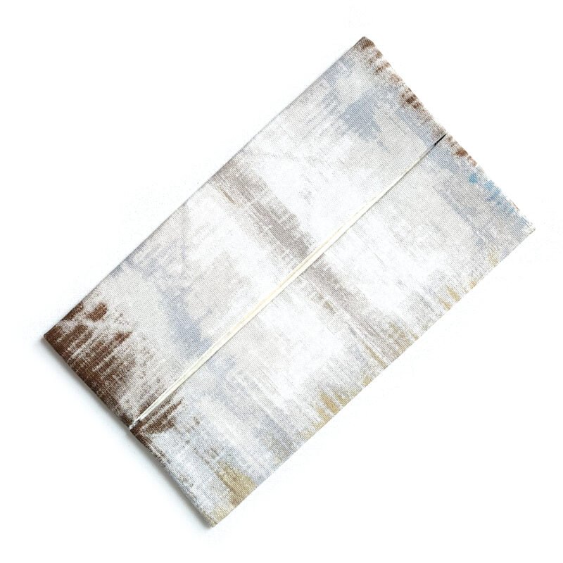flat 10" x 6" pouch for facial tissues made from cotton fabric in light earthy hues
